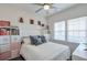 Cozy bedroom with a double bed, stylish decor, and a ceiling fan at 6601 Cadence Blvd, Atlanta, GA 30328