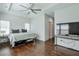 Bedroom with hardwood floors, ceiling fan, and natural light at 6601 Cadence Blvd, Atlanta, GA 30328