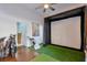 Unique bonus room with artificial turf and a golf simulator setup at 6601 Cadence Blvd, Atlanta, GA 30328