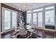 Dining area with stylish lighting, dark accent wall, and doors to the exterior at 6601 Cadence Blvd, Atlanta, GA 30328