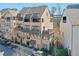 Charming brick townhome with multiple balconies and a well-maintained landscaped front yard at 6601 Cadence Blvd, Atlanta, GA 30328