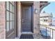 Elegant dark front door with brick surround and overhead arbor at 6601 Cadence Blvd, Atlanta, GA 30328