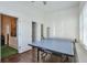 Bright game room featuring a ping pong table and hardwood floors at 6601 Cadence Blvd, Atlanta, GA 30328