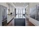 Modern kitchen featuring stainless steel appliances and a large center island at 6601 Cadence Blvd, Atlanta, GA 30328