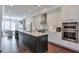 Modern kitchen features a large island, stainless steel appliances, and bright white cabinetry at 6601 Cadence Blvd, Atlanta, GA 30328