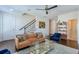 Bright living room featuring hardwood floors, comfortable seating and natural light at 6601 Cadence Blvd, Atlanta, GA 30328