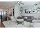 Spacious living room with modern decor, a gray couch, and a plush white rug at 6601 Cadence Blvd, Atlanta, GA 30328