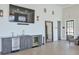 A stylish lounge area features a kitchenette, large TV, and modern decor, perfect for relaxation and socializing at 6601 Cadence Blvd, Atlanta, GA 30328