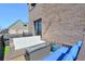 Outdoor patio with comfortable seating, a fire pit, and a brick exterior at 6601 Cadence Blvd, Atlanta, GA 30328