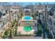 Community pool featuring lounge chairs, green landscaping and various seating areas at 6601 Cadence Blvd, Atlanta, GA 30328