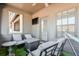 Cozy porch featuring comfortable seating, TV, and neighborhood views at 6601 Cadence Blvd, Atlanta, GA 30328