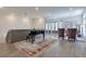 Elegant sitting area with grand piano, plush chairs, and decorative rugs, offering a luxurious and inviting space at 6601 Cadence Blvd, Atlanta, GA 30328