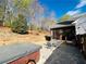 Outdoor patio area with a hot tub, dining set, and a screened-in porch for relaxing and entertaining at 272 Lynshire Sw Ct, Marietta, GA 30064