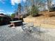 Private backyard with a hot tub, brick patio and table setting at 272 Lynshire Sw Ct, Marietta, GA 30064