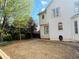 Large, level backyard featuring mature landscaping and a wooden swing set ready for Gathering fun at 272 Lynshire Sw Ct, Marietta, GA 30064