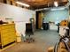 Unfinished basement featuring pegboard, concrete walls, and ample storage space at 272 Lynshire Sw Ct, Marietta, GA 30064