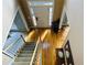 An overhead shot of a foyer with hardwood floors, carpet stairs, and a two story entrance and decor at 272 Lynshire Sw Ct, Marietta, GA 30064