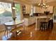 Bright kitchen with white cabinetry, granite countertops, stainless appliances, and breakfast nook at 272 Lynshire Sw Ct, Marietta, GA 30064