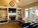 Open living area featuring built-in shelving, fireplace, ceiling fan, and access to an outdoor space at 272 Lynshire Sw Ct, Marietta, GA 30064