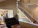 Bright living room with staircase, hardwood floors and open access to the kitchen creates a sense of spaciousness at 272 Lynshire Sw Ct, Marietta, GA 30064