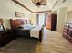 Comfortable main bedroom with a tray ceiling, ceiling fan, and a full set of bedroom furniture at 272 Lynshire Sw Ct, Marietta, GA 30064