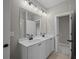 Bright bathroom featuring double vanity, white cabinets, quartz countertops, and modern fixtures at 444 Lower Shoreline Ct Sw, Marietta, GA 30064
