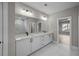 Bright bathroom featuring double vanity and large mirror at 444 Lower Shoreline Ct Sw, Marietta, GA 30064