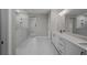 A large bright bathroom with a walk-in shower and double sink vanity at 444 Lower Shoreline Ct Sw, Marietta, GA 30064