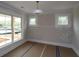 Cozy bedroom featuring large windows and contemporary lighting fixture at 444 Lower Shoreline Ct Sw, Marietta, GA 30064