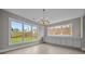 Elegant dining room with large windows offering outdoor views and custom cabinetry below a countertop at 444 Lower Shoreline Ct Sw, Marietta, GA 30064