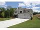 Attractive home with a spacious driveway, three-car garage, and beautifully landscaped yard at 444 Lower Shoreline Ct Sw, Marietta, GA 30064
