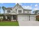 Beautiful two-story home with a three-car garage and a welcoming front porch at 444 Lower Shoreline Ct Sw, Marietta, GA 30064