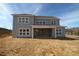 The rear exterior elevation shows a patio and large windows, bringing in plenty of natural light at 444 Lower Shoreline Ct Sw, Marietta, GA 30064