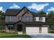Charming two-story home with a three-car garage and landscaped yard at 444 Lower Shoreline Ct Sw, Marietta, GA 30064