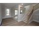 Open foyer featuring stairs with metal spindles, with views to a living space, creating an inviting entrance with architectural details at 444 Lower Shoreline Ct Sw, Marietta, GA 30064