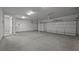 Spacious three-car garage featuring a clean, modern aesthetic and ample space for parking and storage at 444 Lower Shoreline Ct Sw, Marietta, GA 30064