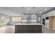 Lovely modern kitchen with a large island, sleek appliances, and stylish pendant lighting at 444 Lower Shoreline Ct Sw, Marietta, GA 30064