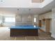 Bright kitchen featuring a large island, pendant lighting, modern cabinets, and abundant counter space, offering both style and functionality at 444 Lower Shoreline Ct Sw, Marietta, GA 30064