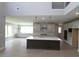 Modern open-concept kitchen with a large island, sleek appliances, and stylish pendant lighting at 444 Lower Shoreline Ct Sw, Marietta, GA 30064