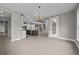 Open-concept living room with modern lighting and high ceilings, blending comfort with a contemporary aesthetic at 444 Lower Shoreline Ct Sw, Marietta, GA 30064