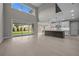 Spacious living room with soaring ceilings, large windows, and an open layout to the kitchen at 444 Lower Shoreline Ct Sw, Marietta, GA 30064