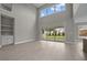 Bright, open-concept living area with sliding glass doors and a view of the landscaped backyard at 444 Lower Shoreline Ct Sw, Marietta, GA 30064