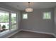 Bright room with three windows providing natural light and views of the outdoors, completed with wood floors at 444 Lower Shoreline Ct Sw, Marietta, GA 30064