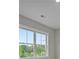 Bright room featuring a large window with views of blue skies and greenery, providing natural light at 444 Lower Shoreline Ct Sw, Marietta, GA 30064