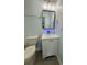 Compact powder room with a single sink vanity at 5075 Forest Downs Ln, Atlanta, GA 30349