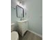 Powder room with a single sink vanity at 5075 Forest Downs Ln, Atlanta, GA 30349