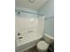 Bathroom featuring a standard tub/shower combo and white fixtures at 5075 Forest Downs Ln, Atlanta, GA 30349
