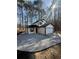 Charming two-story home with a two-car garage, chimney, and fresh landscaping at 5075 Forest Downs Ln, Atlanta, GA 30349