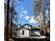 Exterior shot of home with a white siding and black trim at 5075 Forest Downs Ln, Atlanta, GA 30349