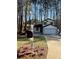 Charming two-story home with a mailbox and fresh landscaping in front yard at 5075 Forest Downs Ln, Atlanta, GA 30349